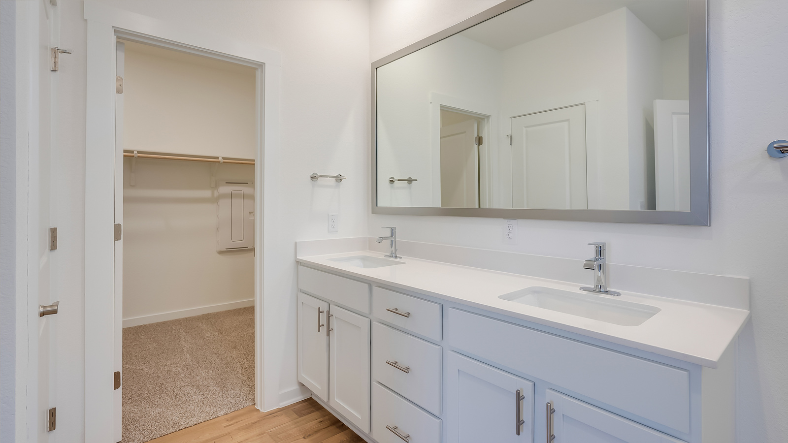 Owner’s ensuite view highlighting vanity space and walk-in shower with spa-inspired design Rosenbusch Ranch