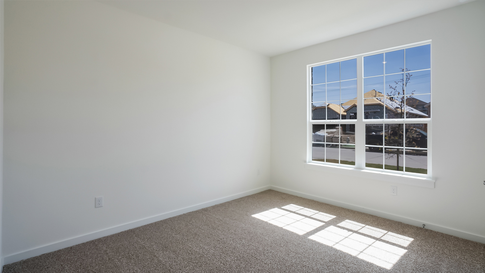 Bedroom 2 offering closet storage and flexible use for guests, office, or study