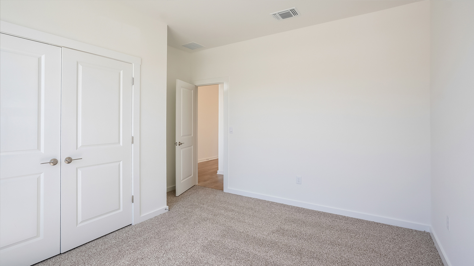 Alternate view of bedroom 2 showing layout and window light