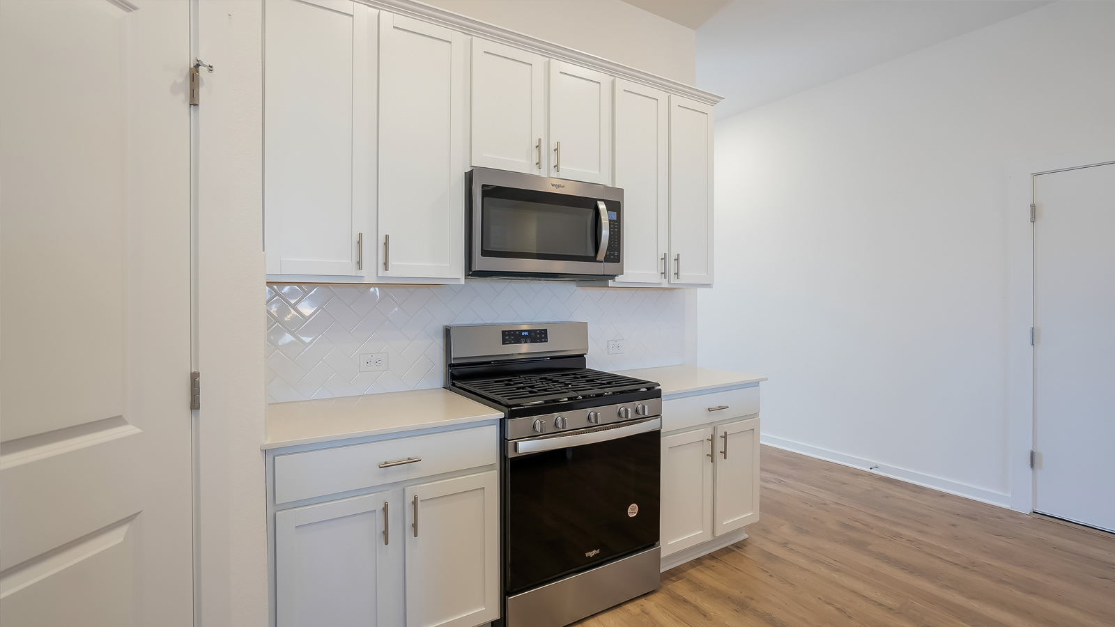 View from the kitchen into the dining and living areas showcasing fresh open-concept design