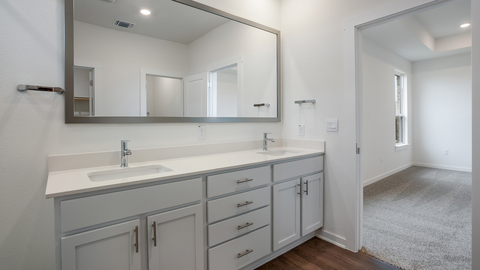Large main bathroom with double vanity sink.