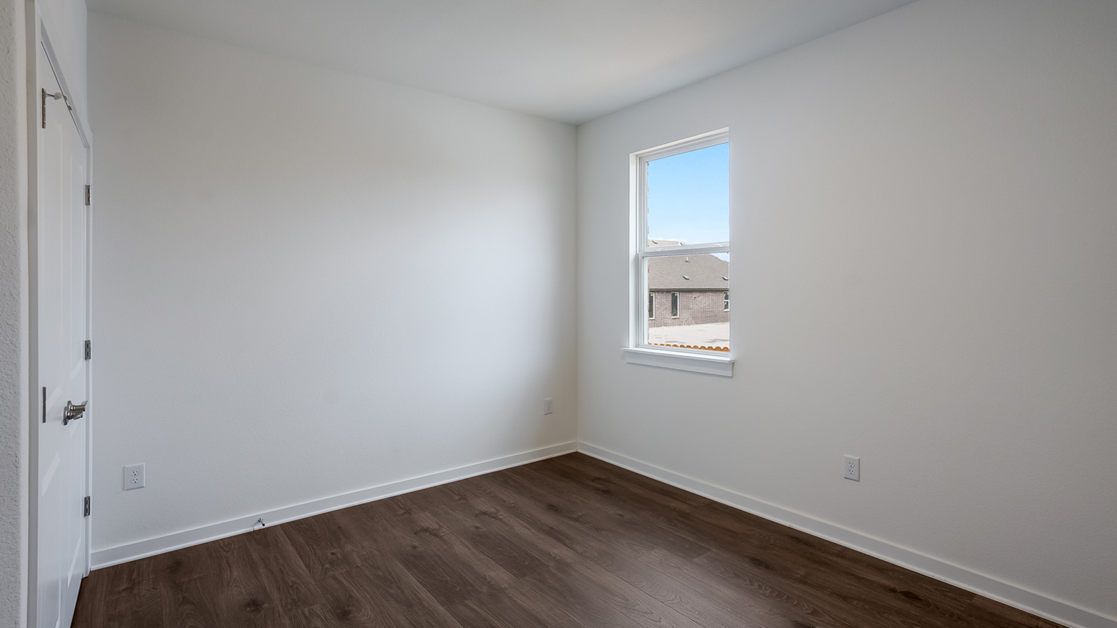 Bedroom 2 with carpeted floors.