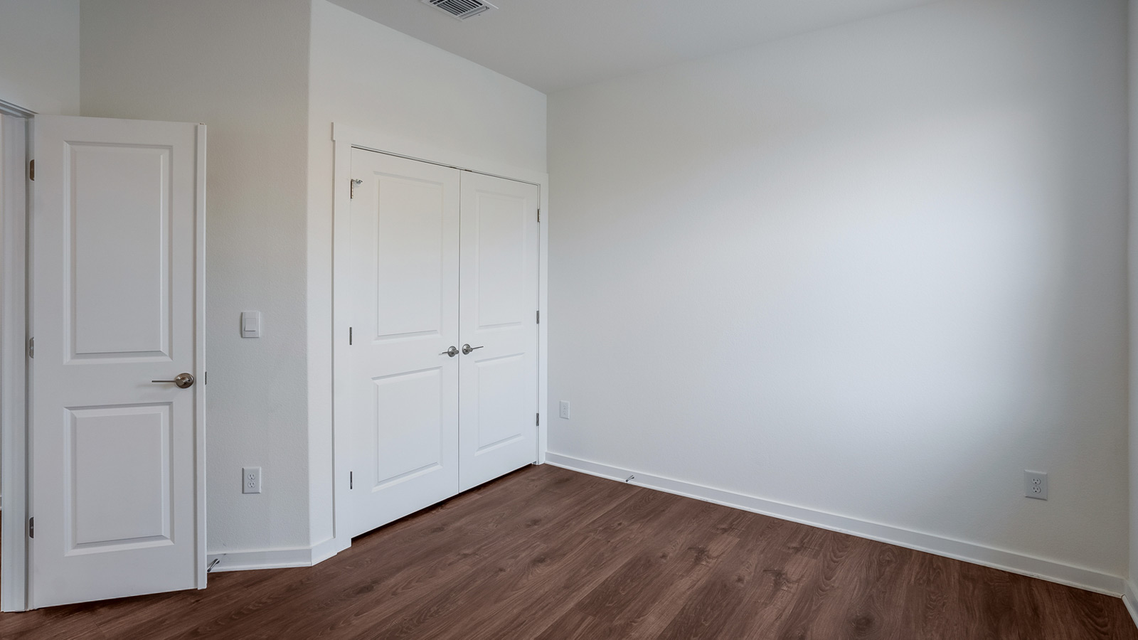 Bedroom 2 with carpeted floors.