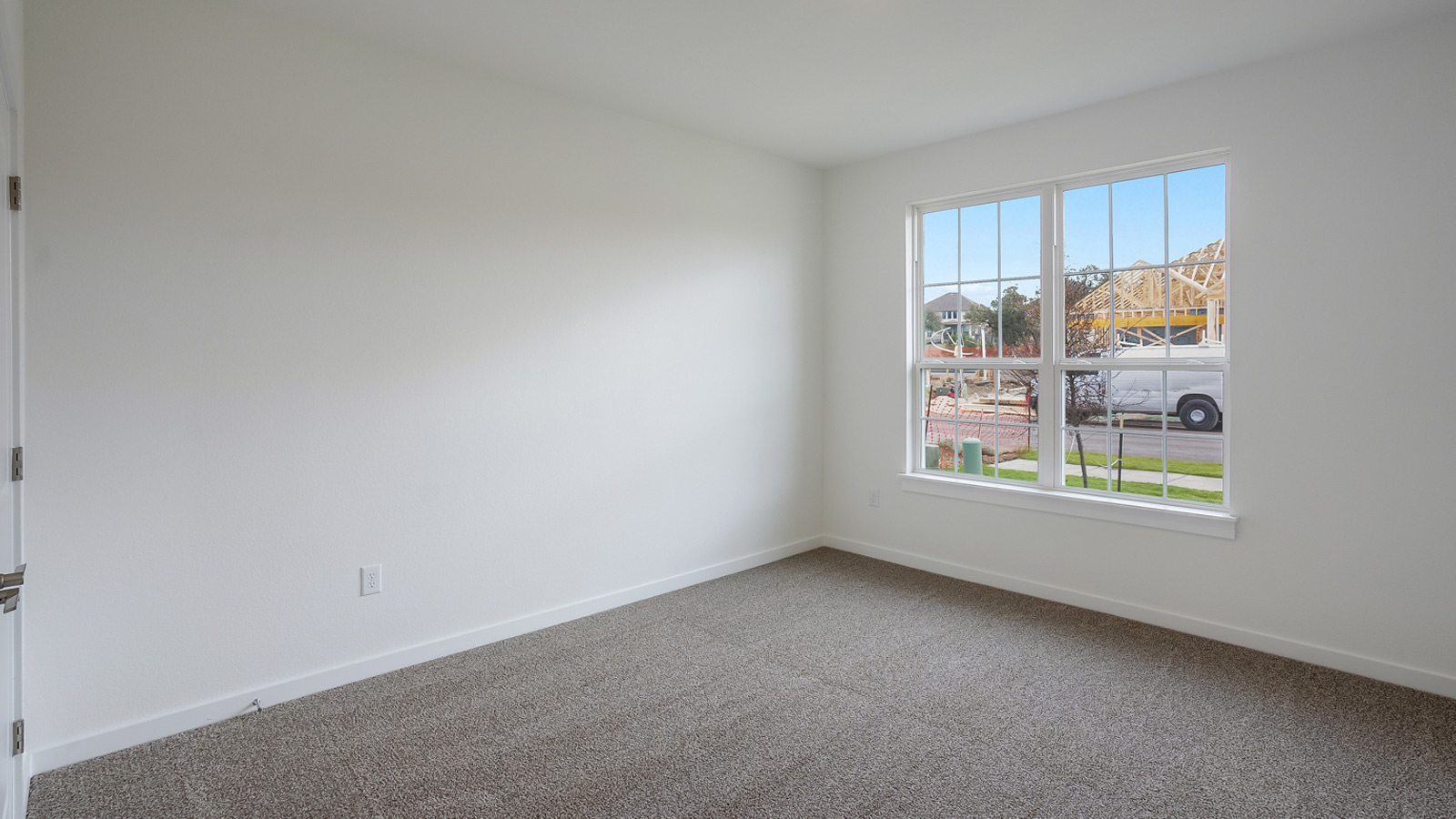 Bedroom 3 with carpeted floors.