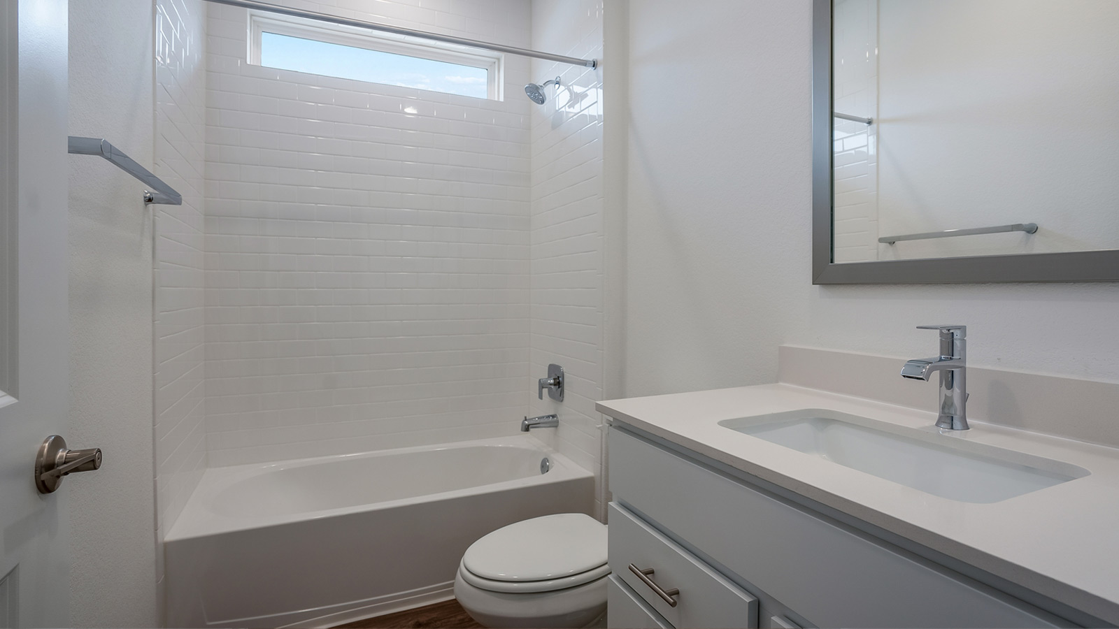 Bathroom 2 with single vanity sink and bathtub.