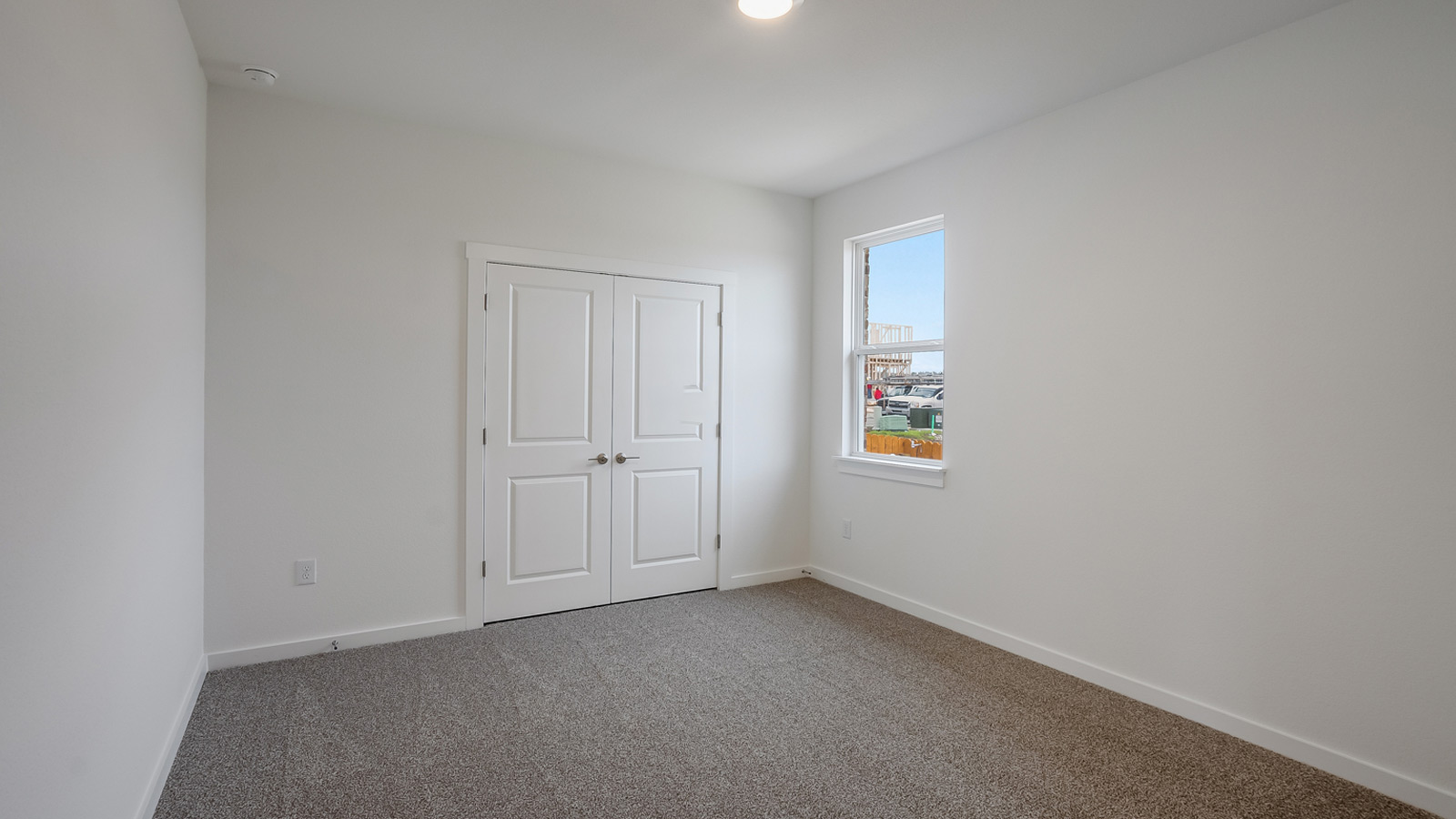 Bedroom 4 with carpeted floors.