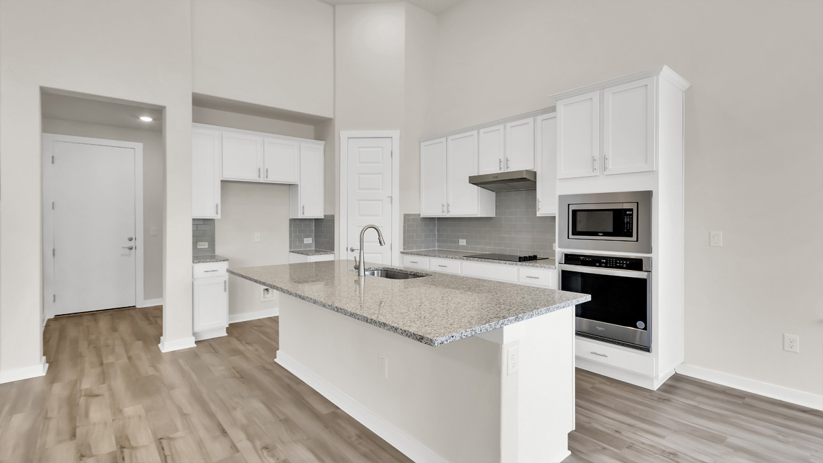 New appliances included, and a larger kitchen island, a sink, seating anchor our kitchen, pantry, near dining, living rooms