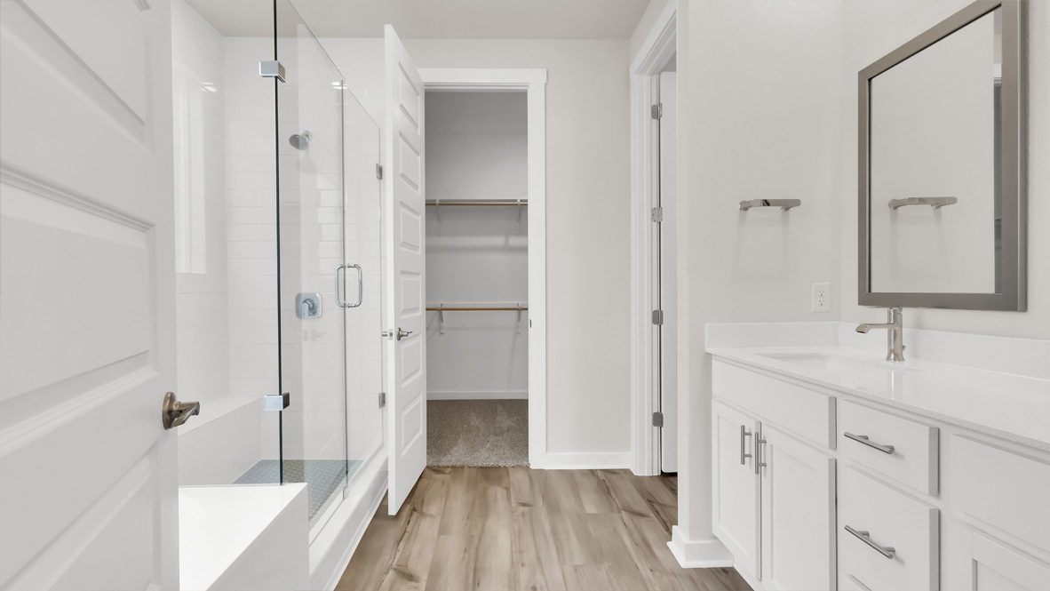 Owner’s ensuite in a new build home offers function and style with a walk-in closet, spa-like ensuite