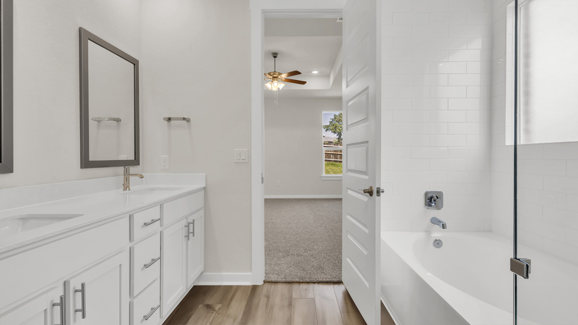 Owner’s ensuite in a D.R. Horton new build home offers function and style with a walk-in closet, spa-like ensuite