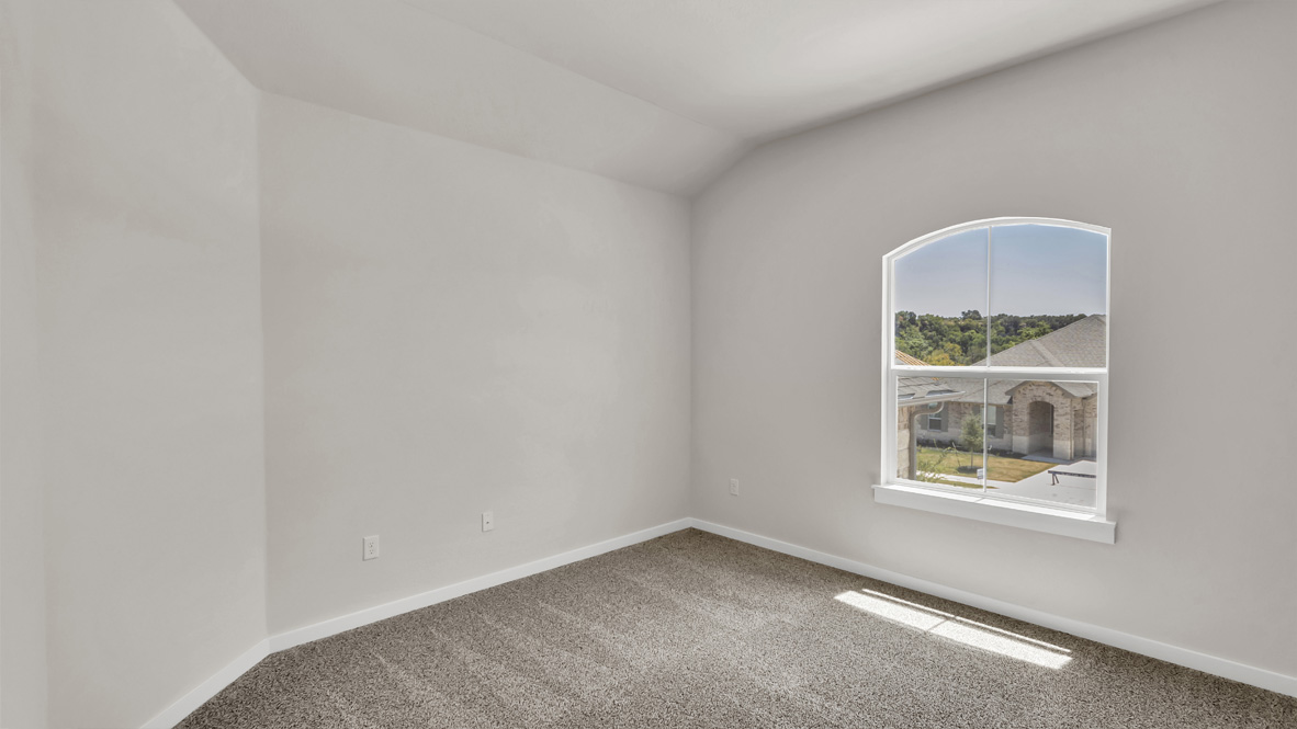 Secondary bedroom showcases space via single door closet, window, convenient home access to multi-use upstairs loft Rosenbusch Ranch