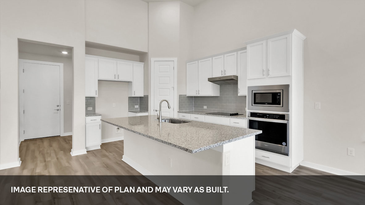 Gourmet kitchen with stainless steel appliances and Silestone® or quartz countertops.