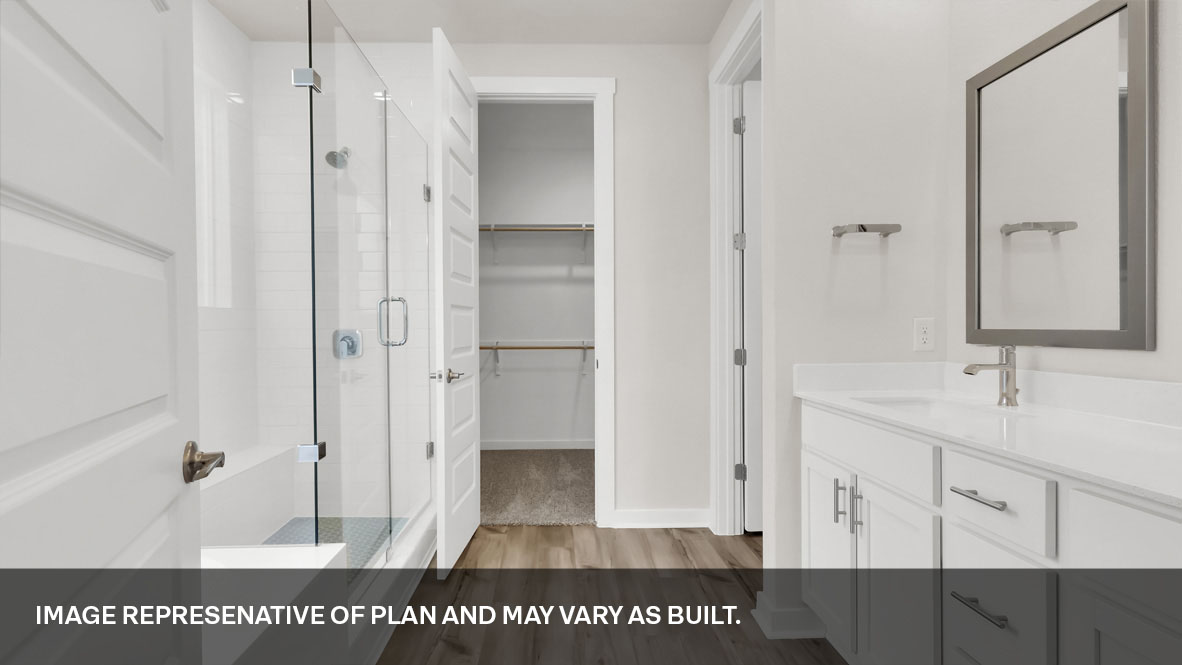 Bathroom 1 with double vanity sink and walk-in shower.