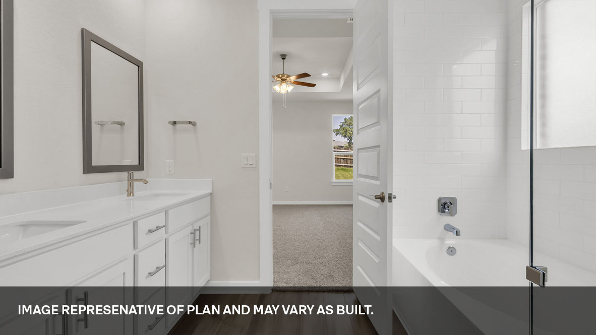 Large bathtub featured in bathroom 1.