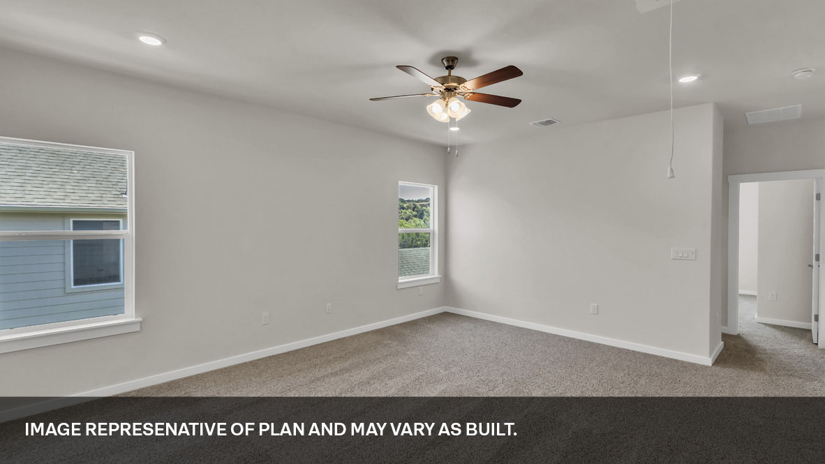 Upstairs loft with carpeted floors and two windows.