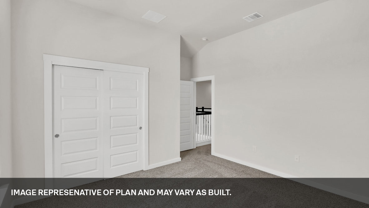 Bedroom 3 with carpeted floors and closet.