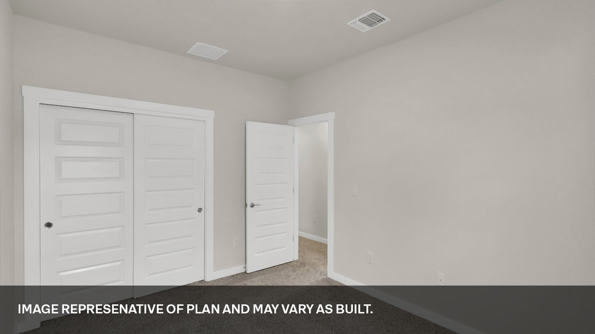Bedroom 5 with carpeted floors and closet.