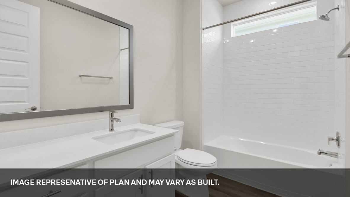 Secondary bathroom located off the foyer.