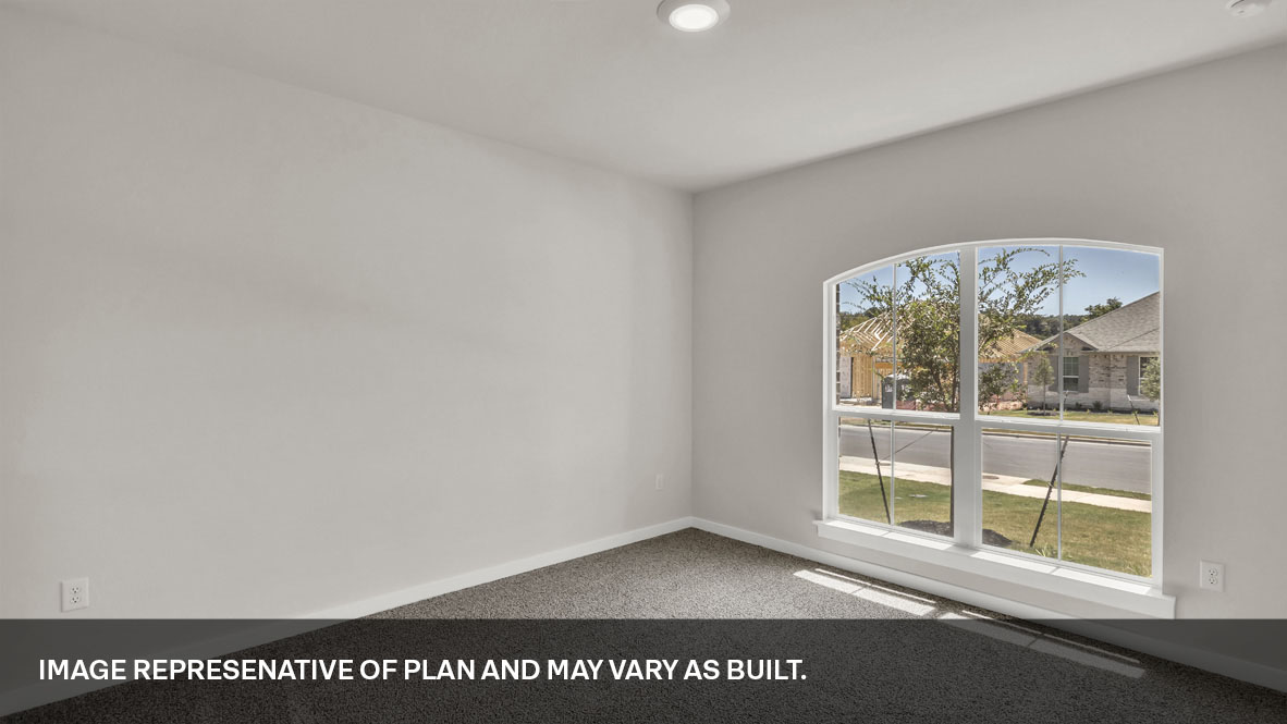 Bedroom 2 located at the front of the home.
