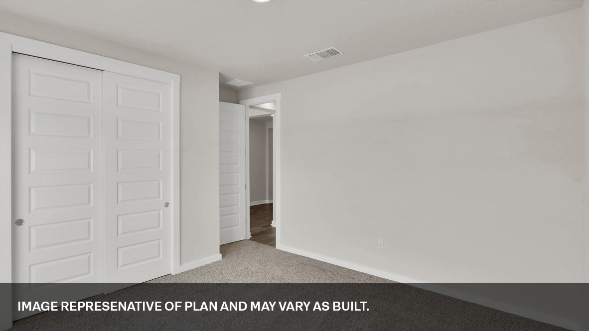 Bedroom 2 with carpeted floors and closet.