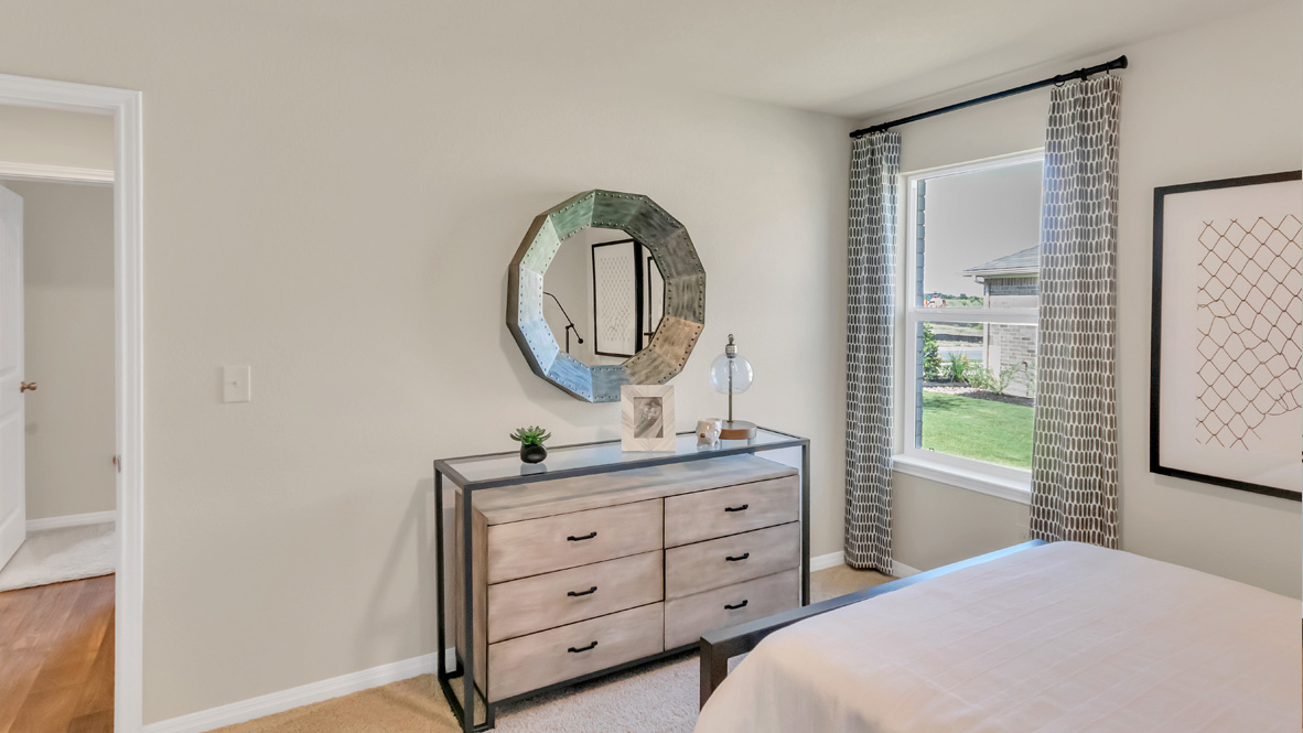 Third bedroom in Rosenbusch Ranch includes natural window light, full closet, connectivity to the residence