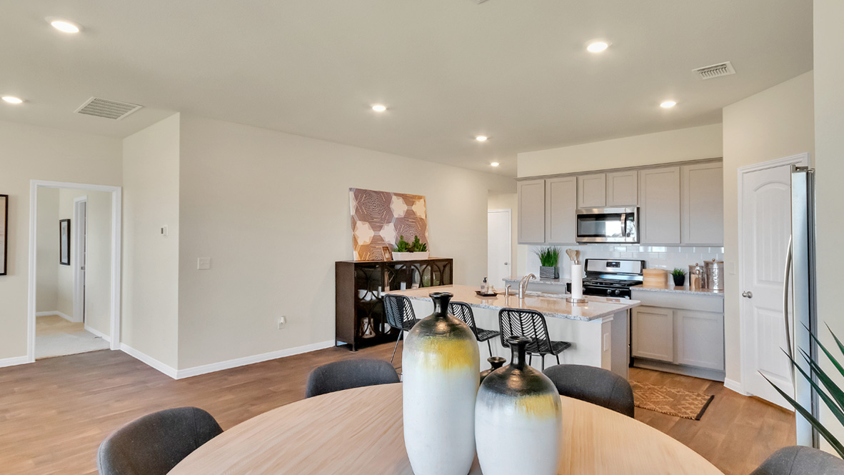 Spacious Kitchen island in this new home with sink, dining areas, daily prep zones, for entertaining and daily life