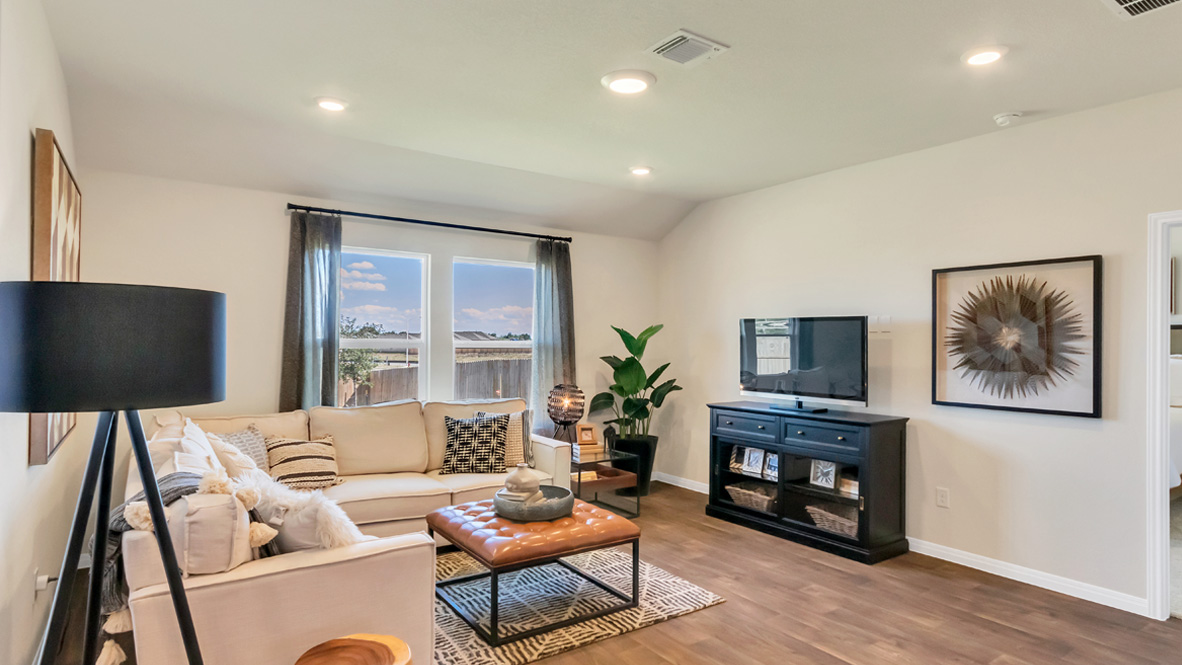 Living room features quality throughout, fresh open concept flowing to the kitchen, dining areas, at Rosenbusch Ranch