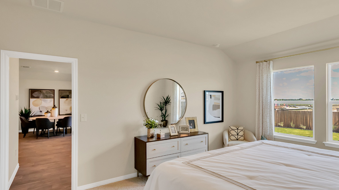 Primary bedroom designed with privacy and space in mind, a flow into a spa-inspired ensuite, walk-in closet on main level