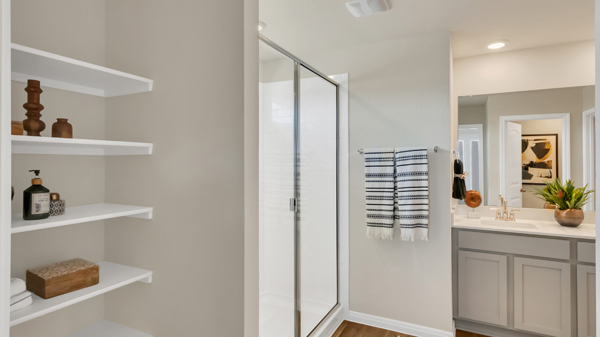 Owner’s ensuite in a new build home offers function and style with a walk-in closet, spa-like ensuite