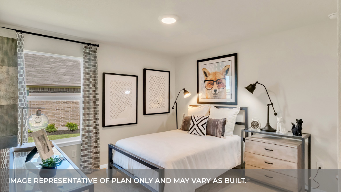 Bedroom three with carpeted floors and single window for natural light.