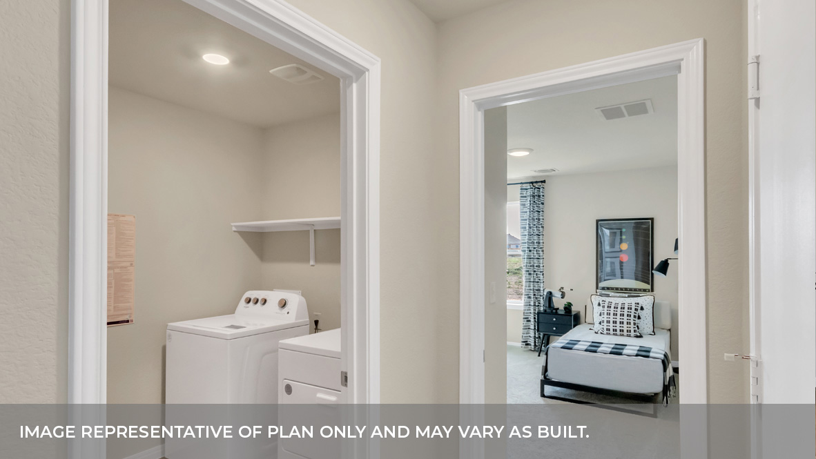 Hallway looking into the laundry and bedroom.