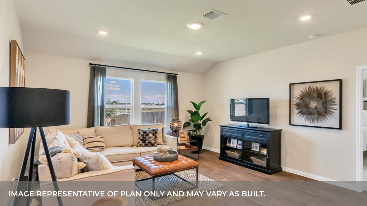 Spacious living area with two large windows for natural lighting.