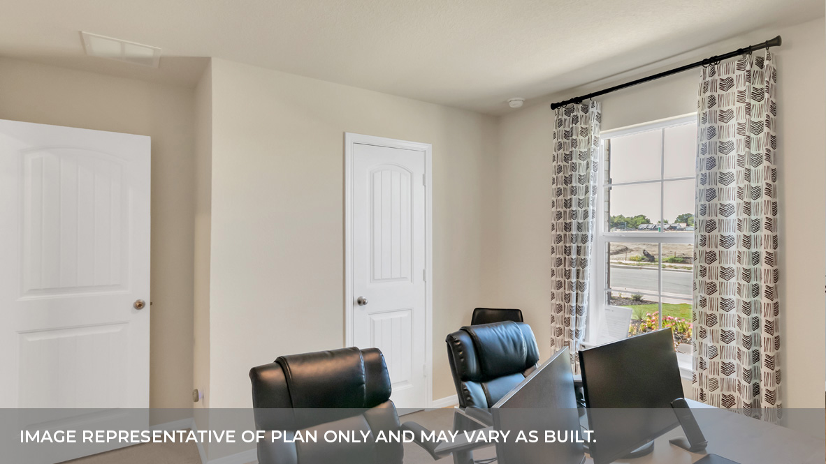 Bedroom two with carpeted floors and large single window and closet door.