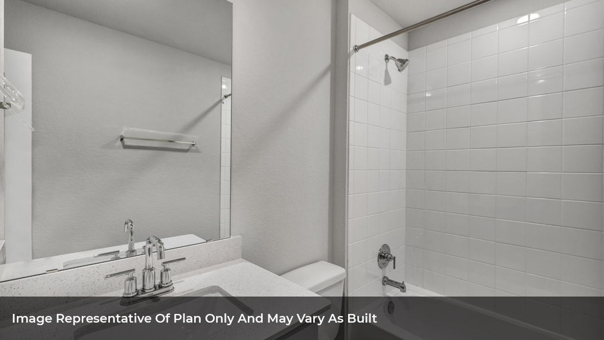 Bathroom with single sink light gray vanity and white granite tops with white tile shower and tub combo.