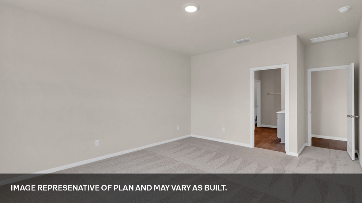 Primary bedroom and door connecting the primary bathroom.