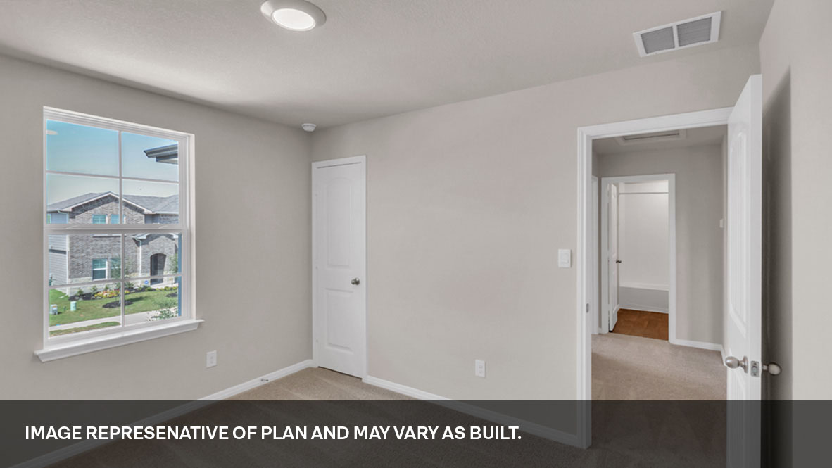 Bedroom with closet door and entry door.