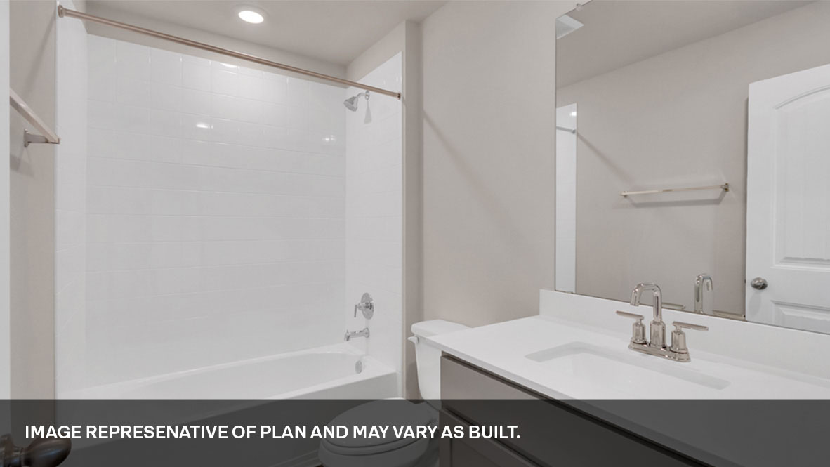 Bathroom with single sink light gray vanity and white granite tops with white tile shower and tub combo.