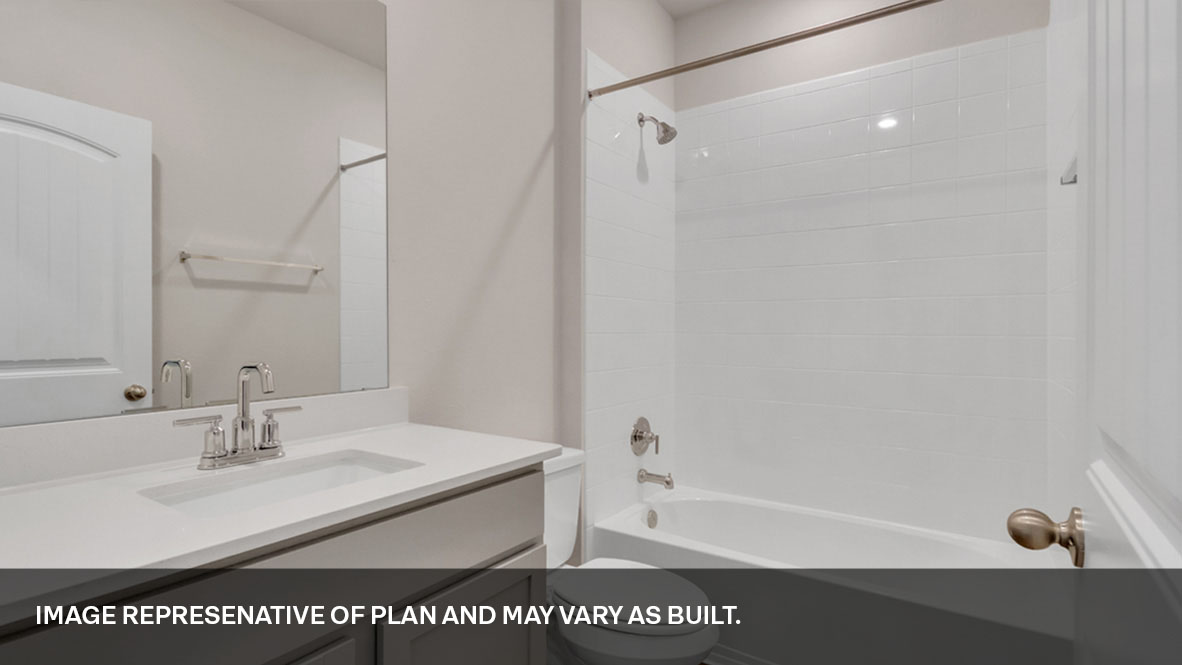 Bathroom with single sink light gray vanity and white granite tops with white tile shower and tub combo.