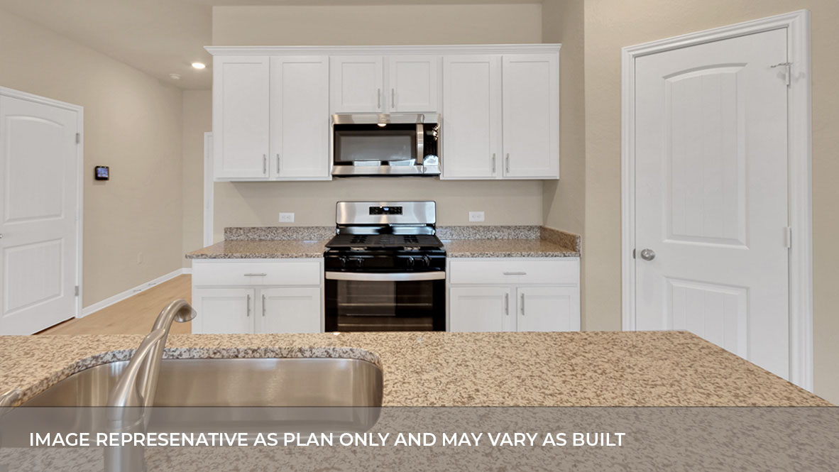 Large kitchen area with open concept view of foyer.