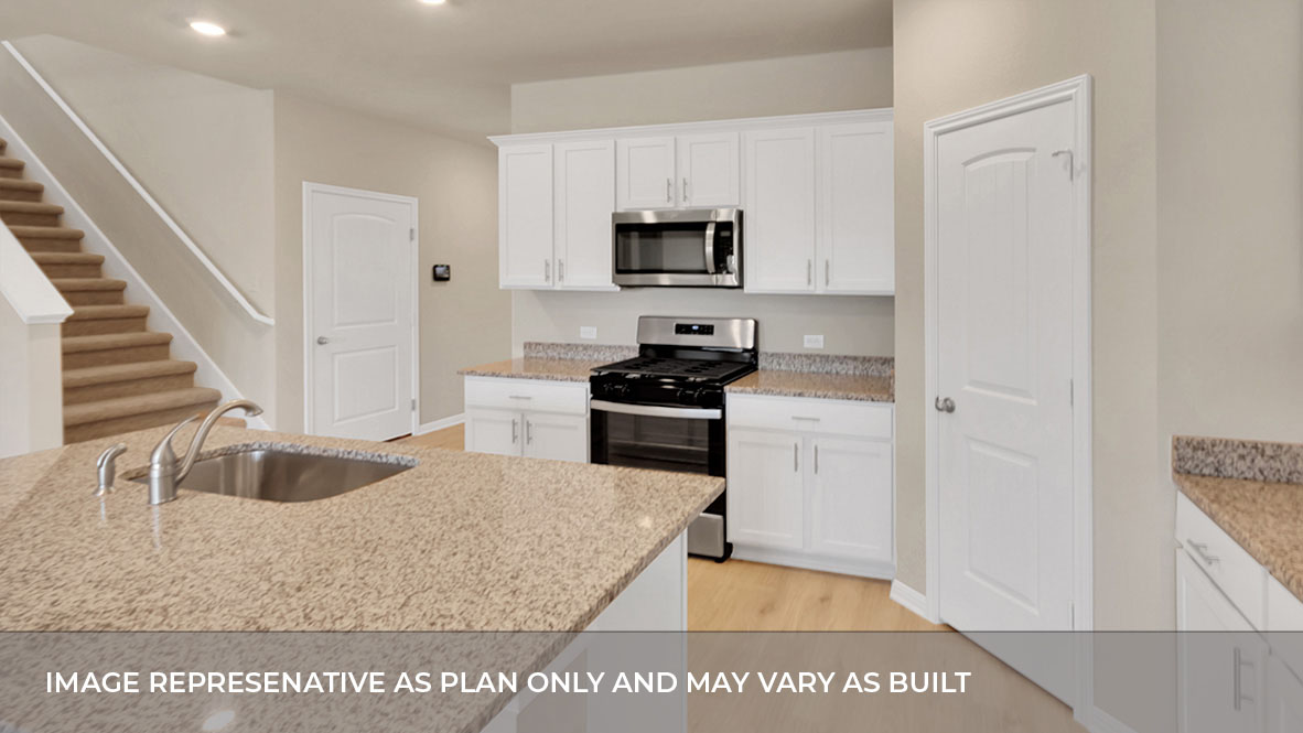 Kitchen area with stainless steel appliances with pantry in the corner.