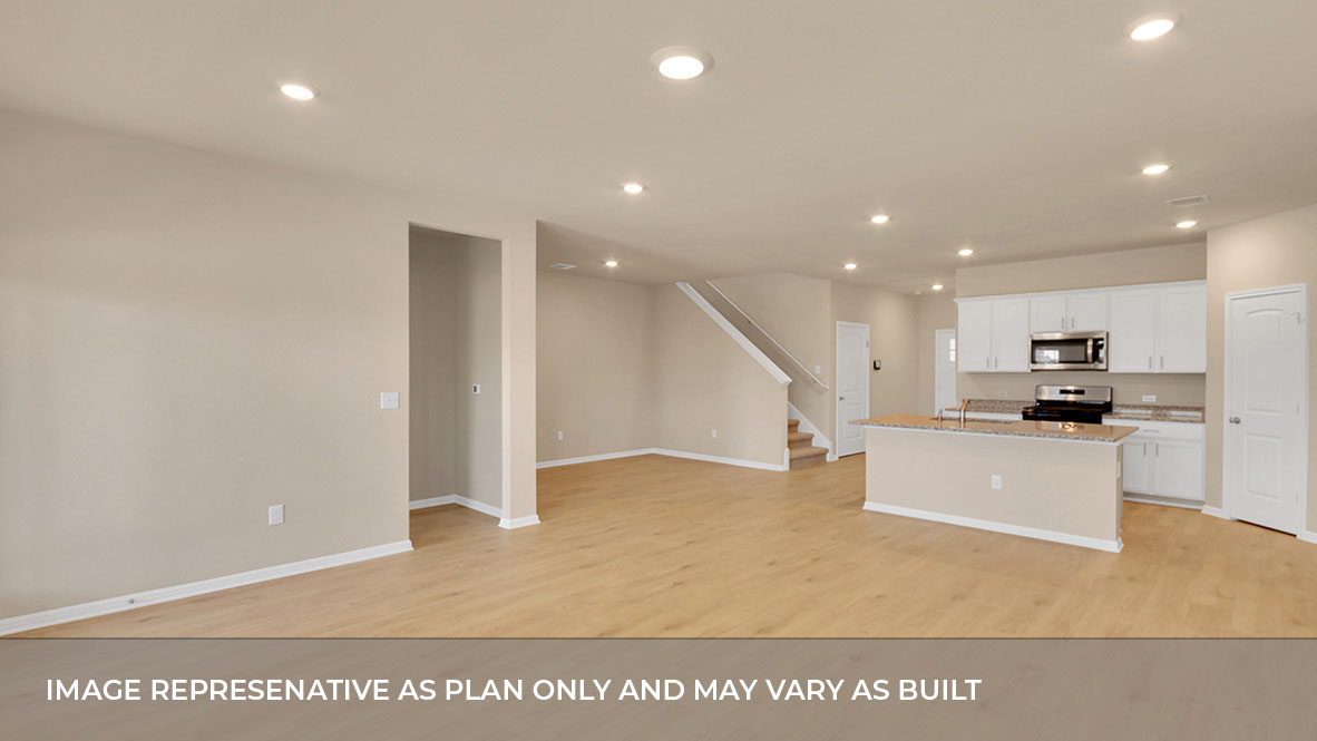 Living area with kitchen and dining area in the back.