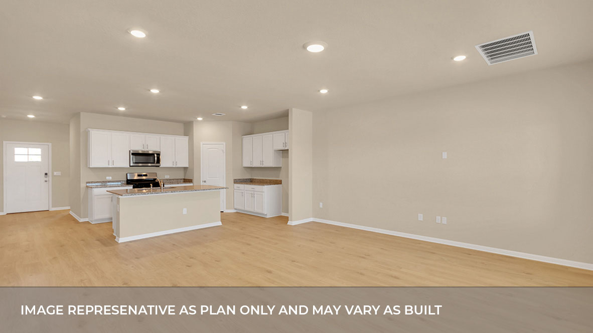 Open concept living and kitchen area with the front entrance foyer.