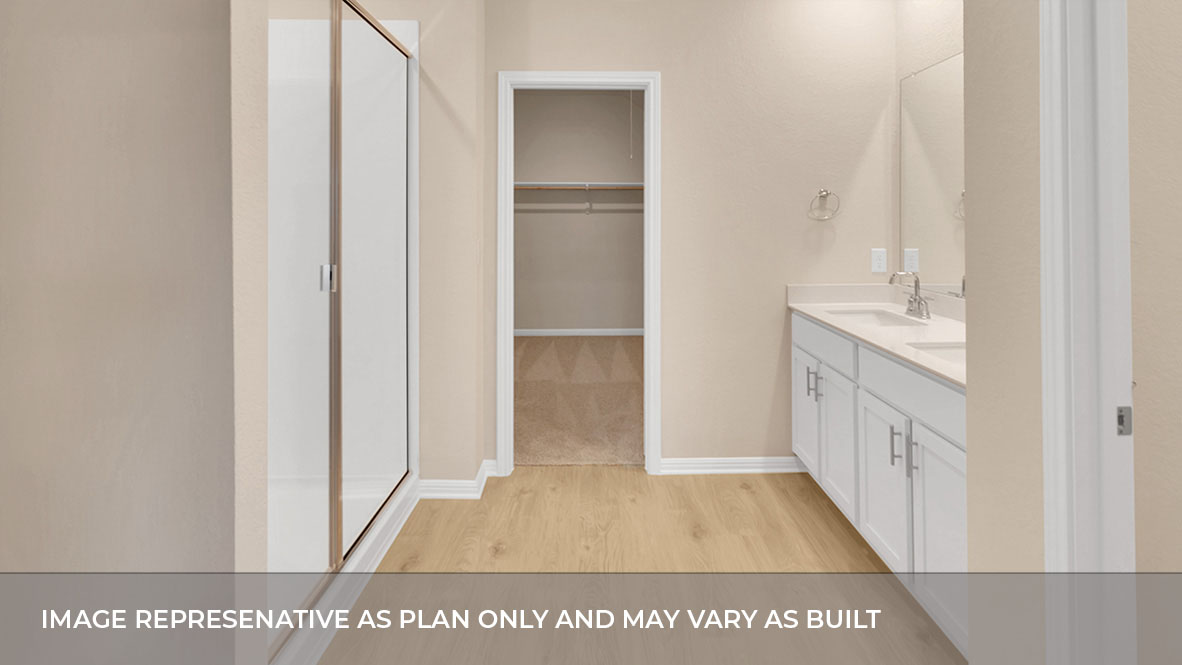 A modern bathroom featuring a double sink white vanity with light tan granite countertops and walk-in shower and with built in shelve with spacious walk in closet.