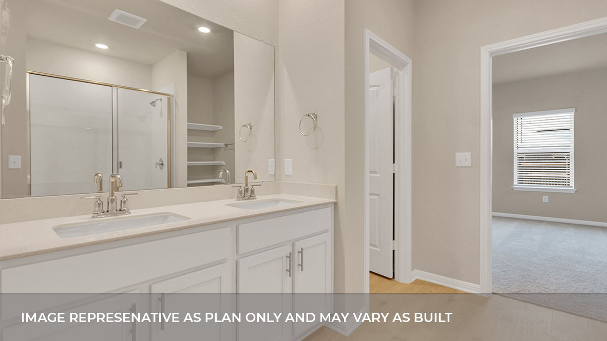 Connecting primary bathroom featuring a double sink white vanity with light tan granite countertops and walk-in shower and with built in shelve with spacious walk in closet.