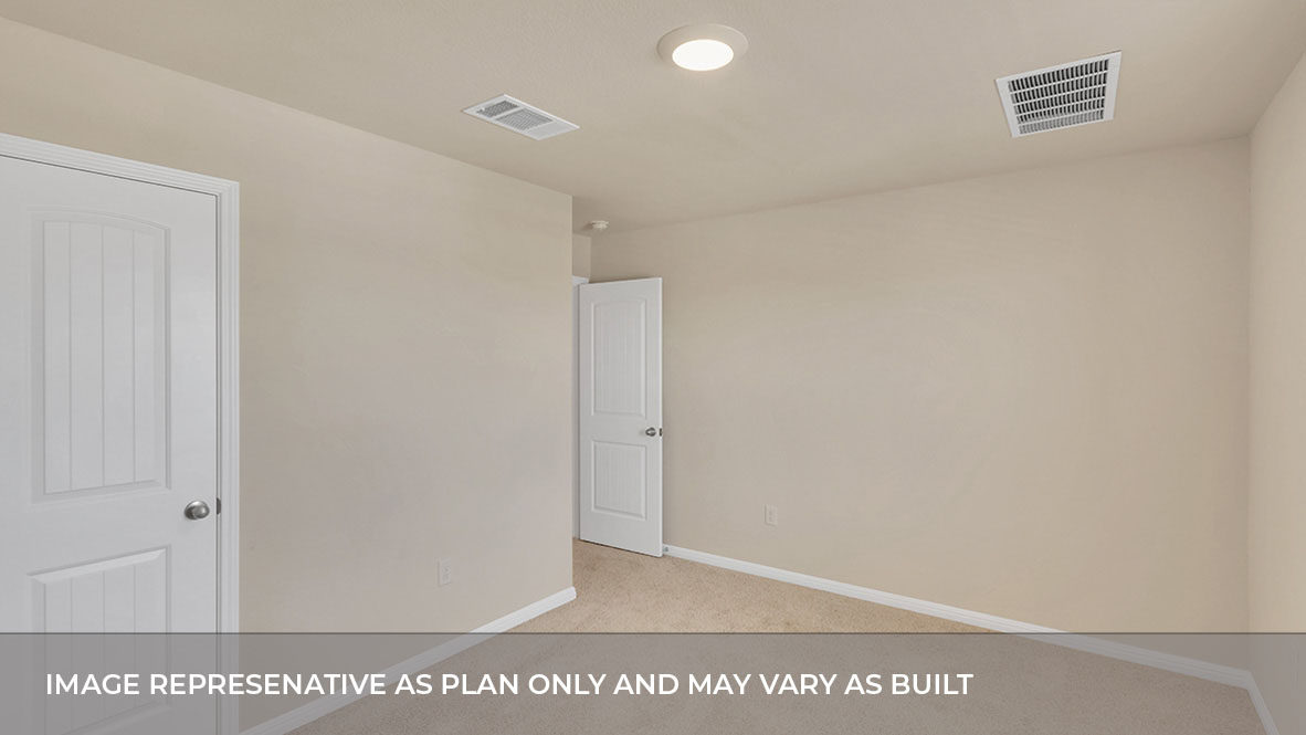 Bedroom with closet door and entry door.