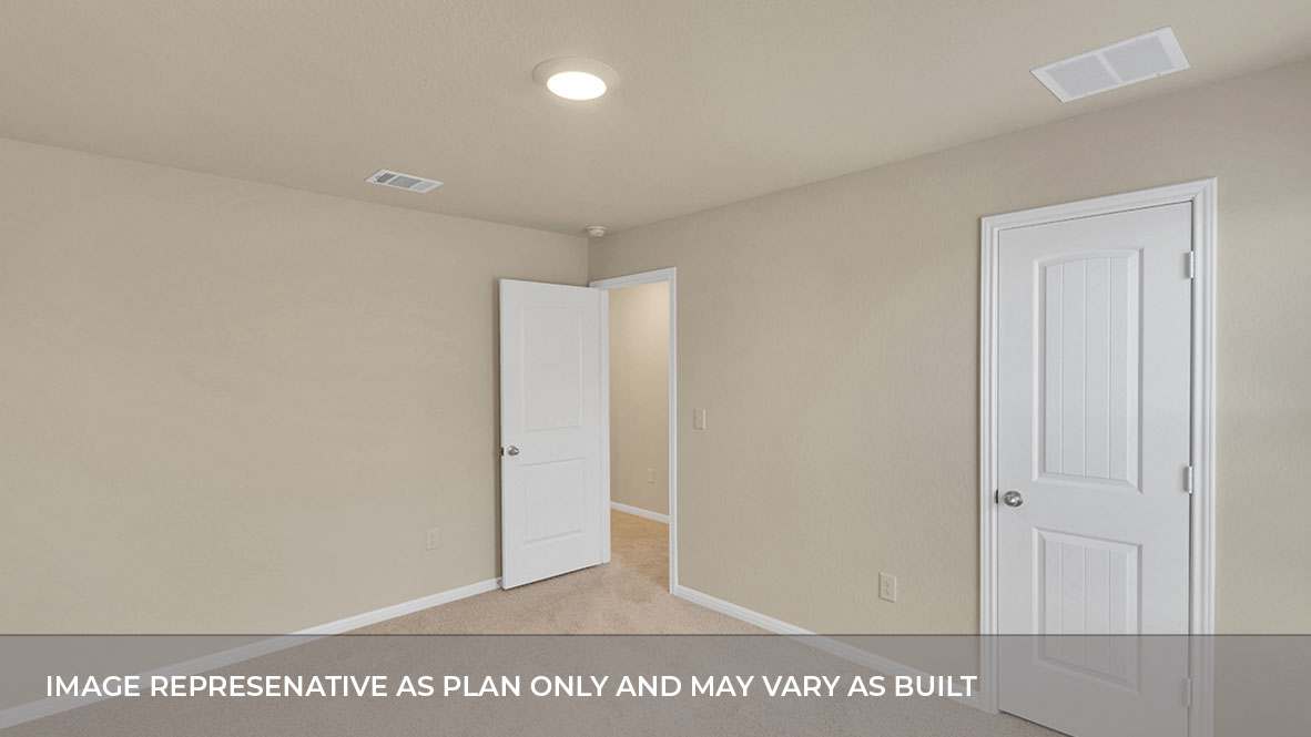 Bedroom with closet door and entry door.