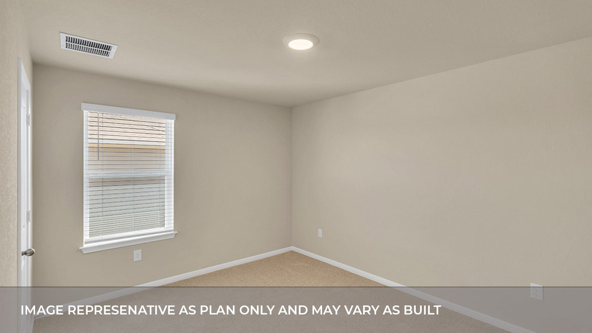 Bedroom with carpeted floors and large single windows for natural light.