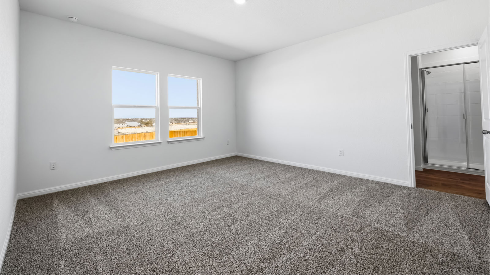 Primary bedroom with window.