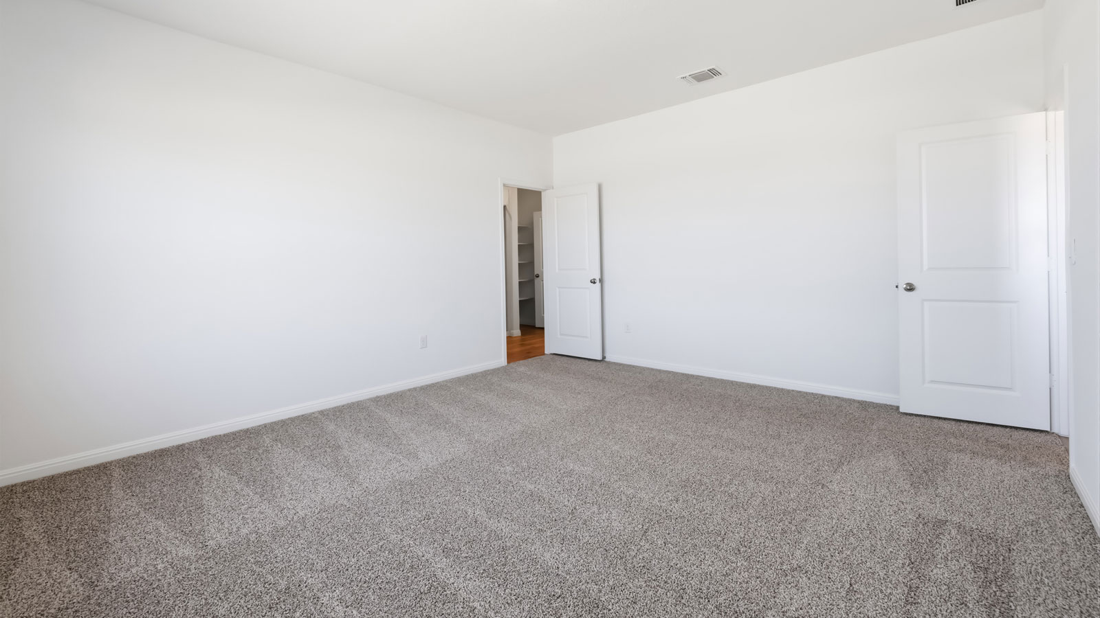 Primary bedroom with window.