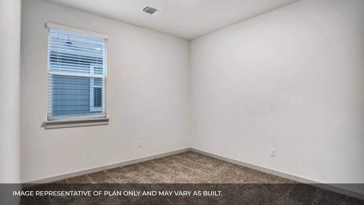 Bedroom with carpeted floors and single window for natural light.