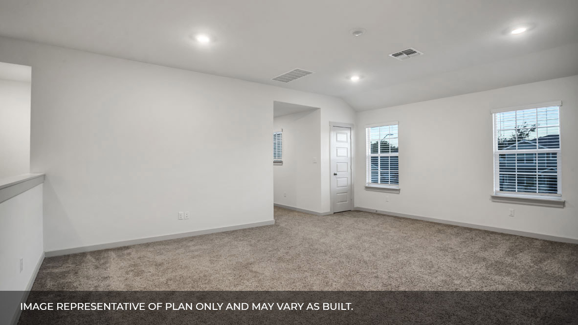 Spacious loft area with two windows with bedrooms to the left.